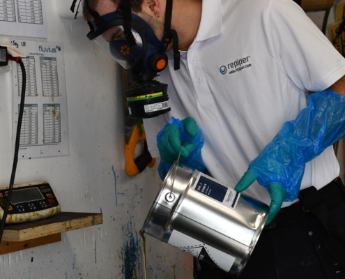 Plumber repairing broken pipe
